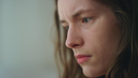 closeup hands holding smartphone in dark room. worried girl looking screen read