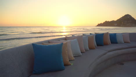 beautiful golden seaside sunset view from comfortable beach lounge sofa