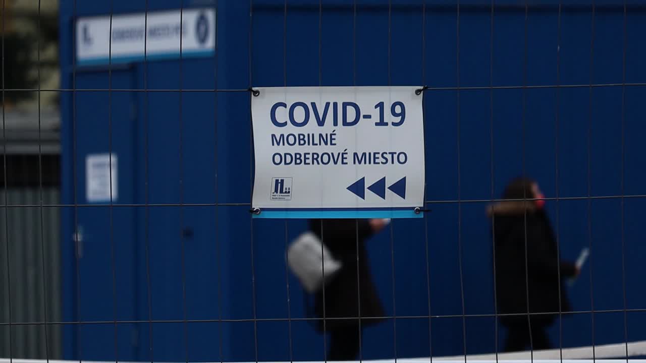 Close up slow motion shot of Covid 19 coronavirus vaccination test centre sign