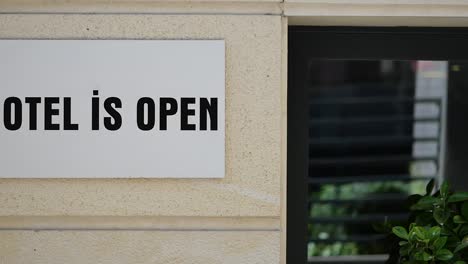 hotel is open sign on building exterior
