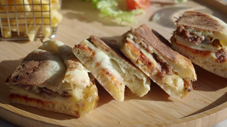 Appetizing Panini Sandwiches with Melted Cheese and French Fries