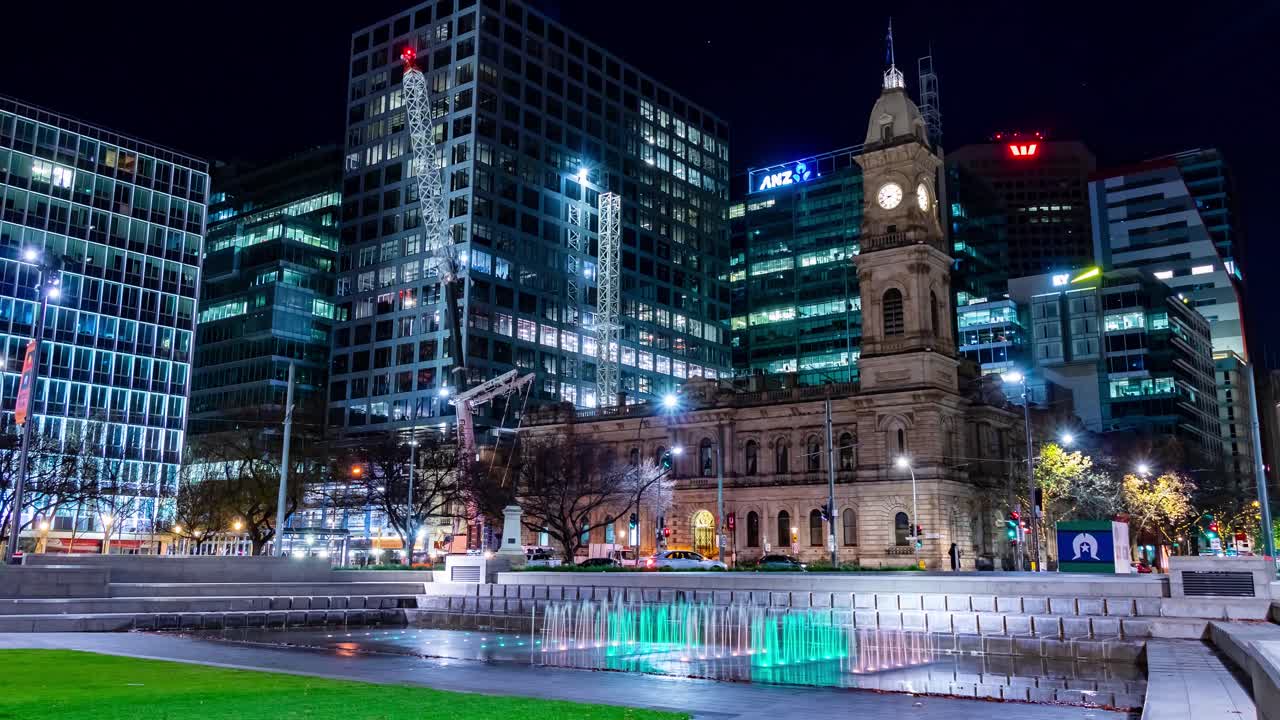 Timelapse of a crane setting up at Victoria Square in Adelaide, South Australia, at night with colourful lighting and small fountains