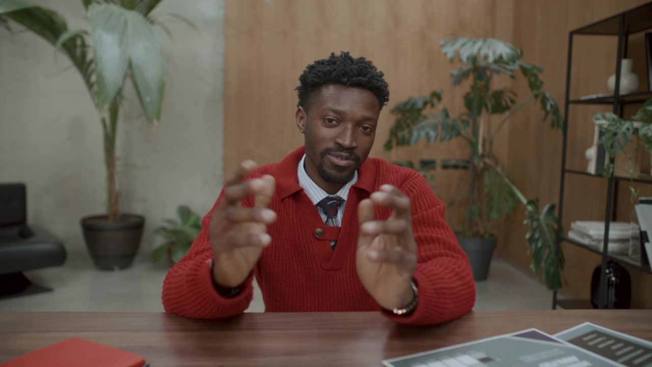 Young Black Man Explaining Business Strategy on Camera during Online Meeting