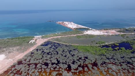 Aerial-riser-view-of-development-site-of-Cabo-Rojo-port,-Pedernales,-Caribbean