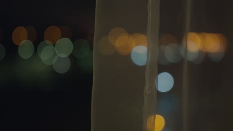 blurred background of night window with curtain