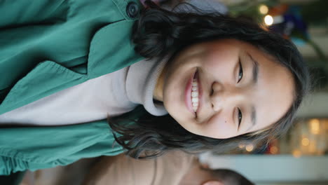 Portrait-of-Cheerful-Asian-Woman-in-Cafe