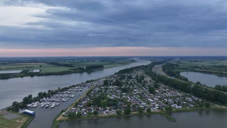 cloudy sunset sky over marina by the hollands diep in moerdijk, netherlands