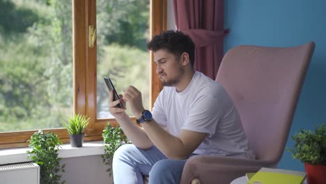 Man-texting-with-happy-expression.