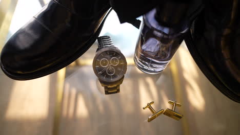 groom's accessories with the bow tie on the table for the wedding day