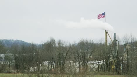 pollution engulfs american flag smoke stack factory