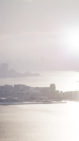 a view of a cityscape shrouded in fog