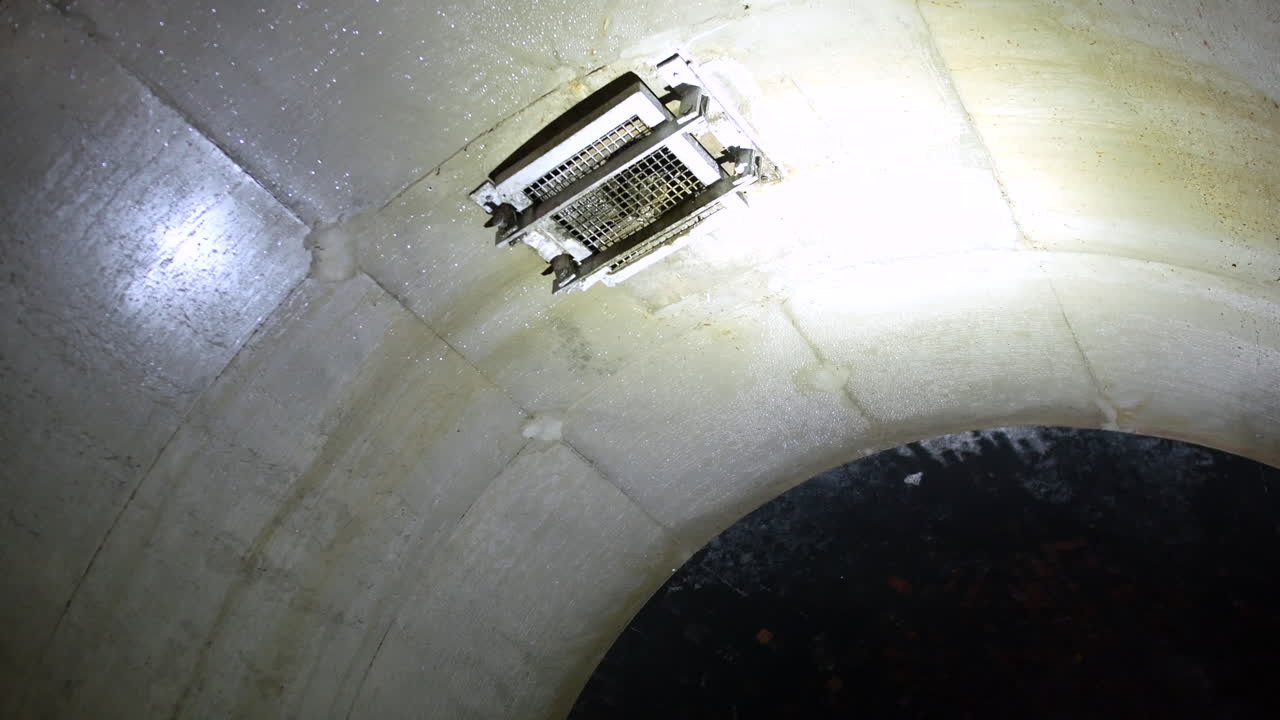 Exploring a Dark and Damp Underground Tunnel