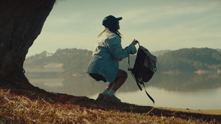 Woman Hiking by a Lake