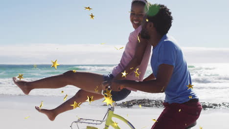 couple enjoying beach bicycle ride with golden stars animation overlay