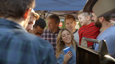 Slow-Motion-Shot-Of-Sports-Fans-Tailgating-In-Parking-Lot