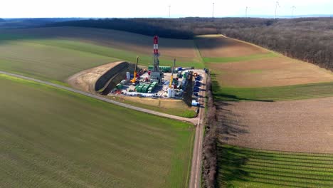 construction site of oil well drilling rig with cranes in an oil-rich field