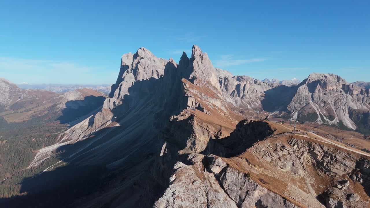 Iconic Seceda ridgeline in Italian Alps with famous Fermeda towers, aerial