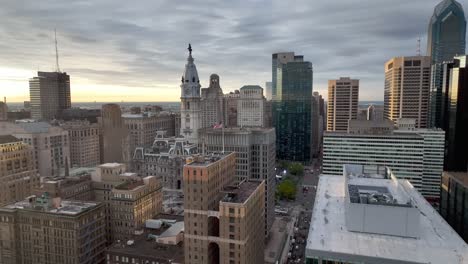 american flag flys atop building in philadelphia pennsylvania skyline