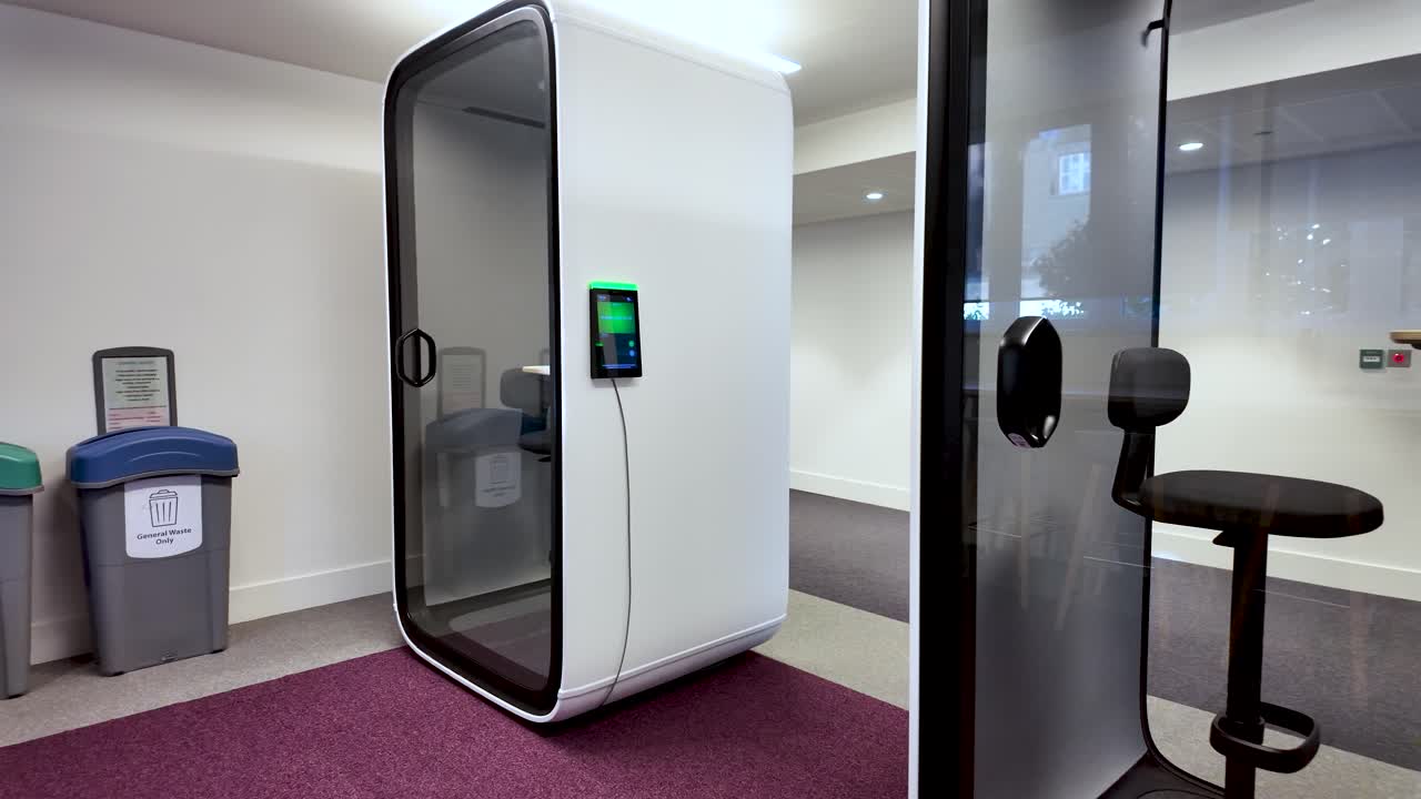 Minimalist soundproof office pods for focused work in an open collaborative environment