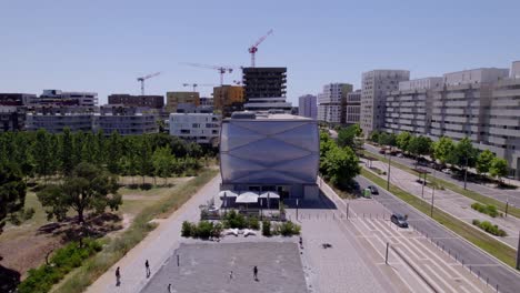 Construction-sights-in-the-distance-aerial-shot-of-Montpellier,-France