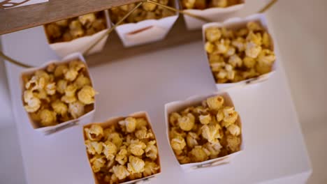 decorative popcorn packaging with teddy bears and balloons on white table for kids
