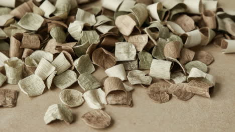 pile of curled textured paper scraps in earth tones