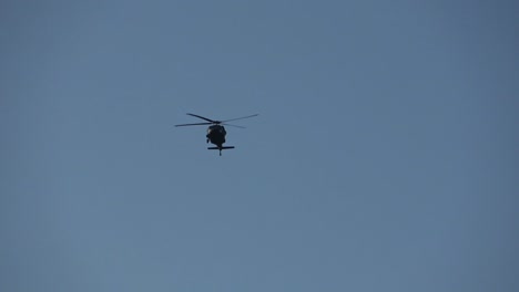 helicopter flying overhead in the sky