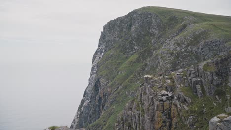 Majestic-rocky-cliff-of-Runde-island,-dolly-forward-view