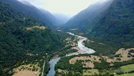 Aerial-orbit-of-the-Cochamo-Valley-on-a-cloudy-day,-Chile