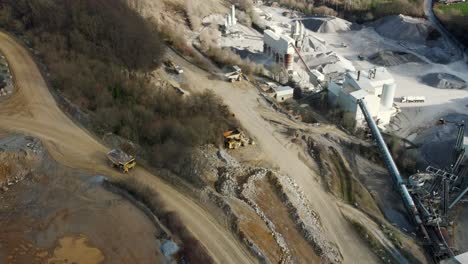 from rock to lime: a look at the processes and equipment in a german limestone quarry, a massive rock truck driving on a mining road towards the plant