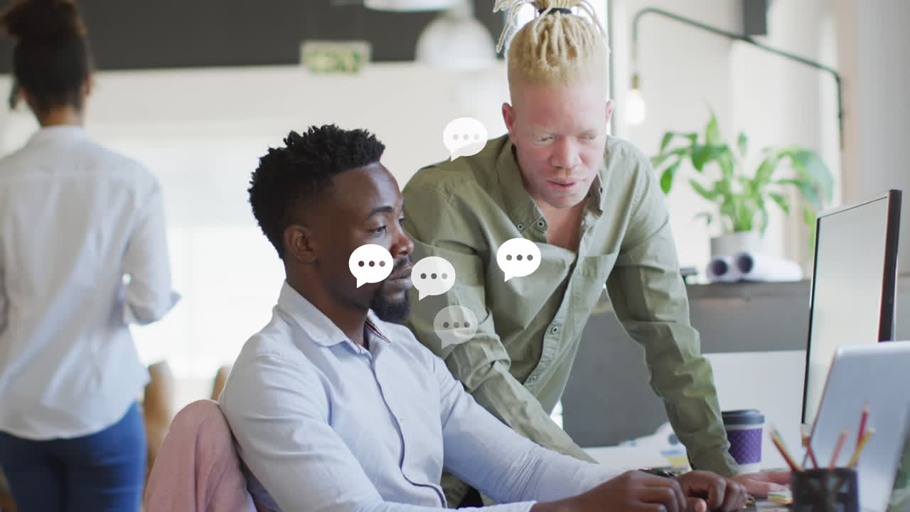 Animation of emoji falling over business people wearing phone headsets