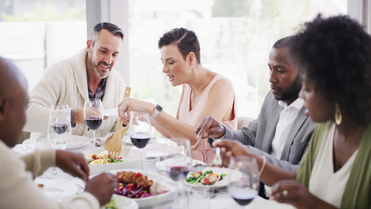 Diverse and mature group of friends eating