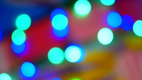 blurred colorful lights. red, green, yellow, orange, blue defocused glittering bokeh festive background.