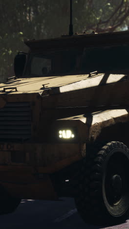 armored military truck driving on a desert road