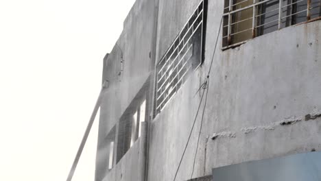 firemen action, streams of water directed at fire in building close up