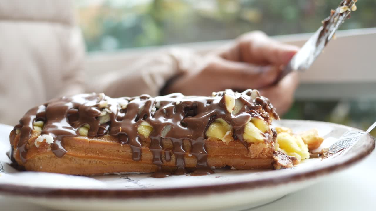 Eating a Chocolate Eclair