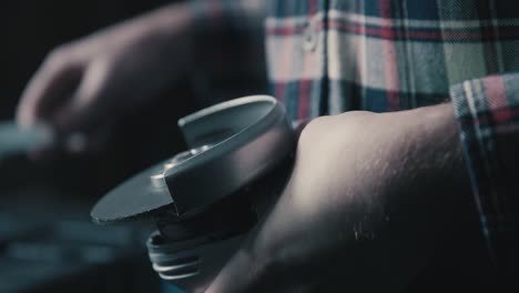 man replaces disk on an angle grinder