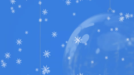 animation of snow falling over christmas bauble decorations on blue background