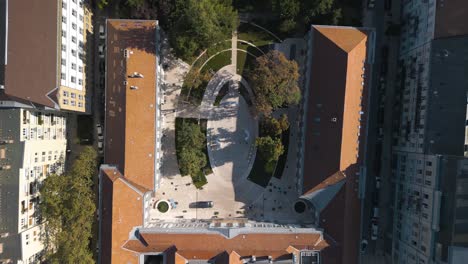 top down aerial view of city buildings and park in budapest, hungary