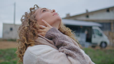 woman vacationer relaxing nature looking at cloudy sky close up. relaxed lady