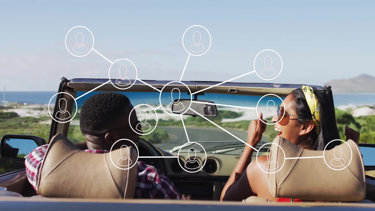Driving convertible, people with social network icons overlaying animation on screen