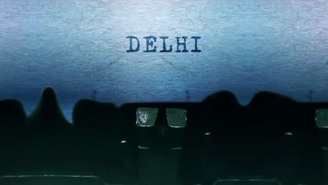 delhi word closeup being typing and centered on a sheet of paper on old vintage typewriter