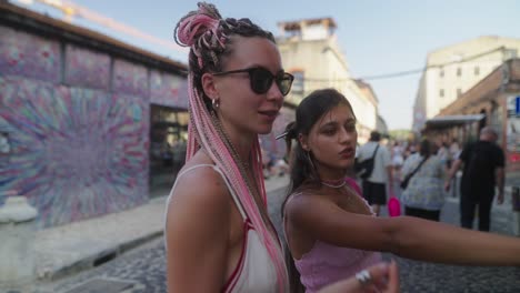 women walking on a city street