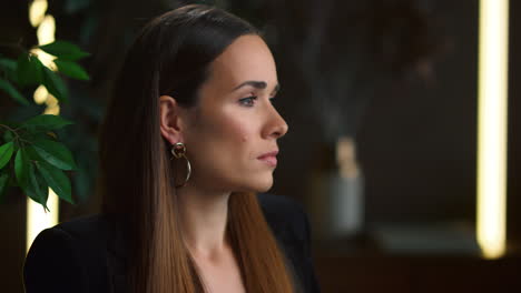 thoughtful businesswoman in home office. focused professional posing at camera