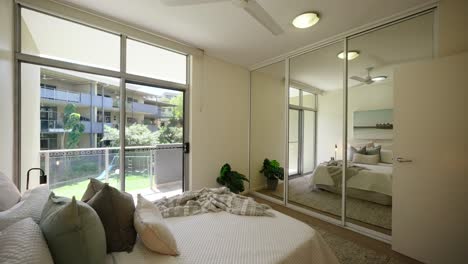 minimalist bedroom interior in a modern home, featuring natural lighting and a calming atmosphere. interior of house home staged for real estate.