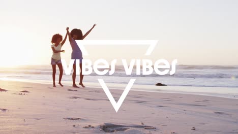 animation of vibes vibes text over african american mother and daughter walking at beach