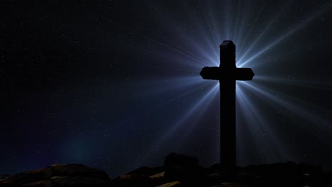 silhouetted cross poles above the rocks and optical flare rays against the star background at night