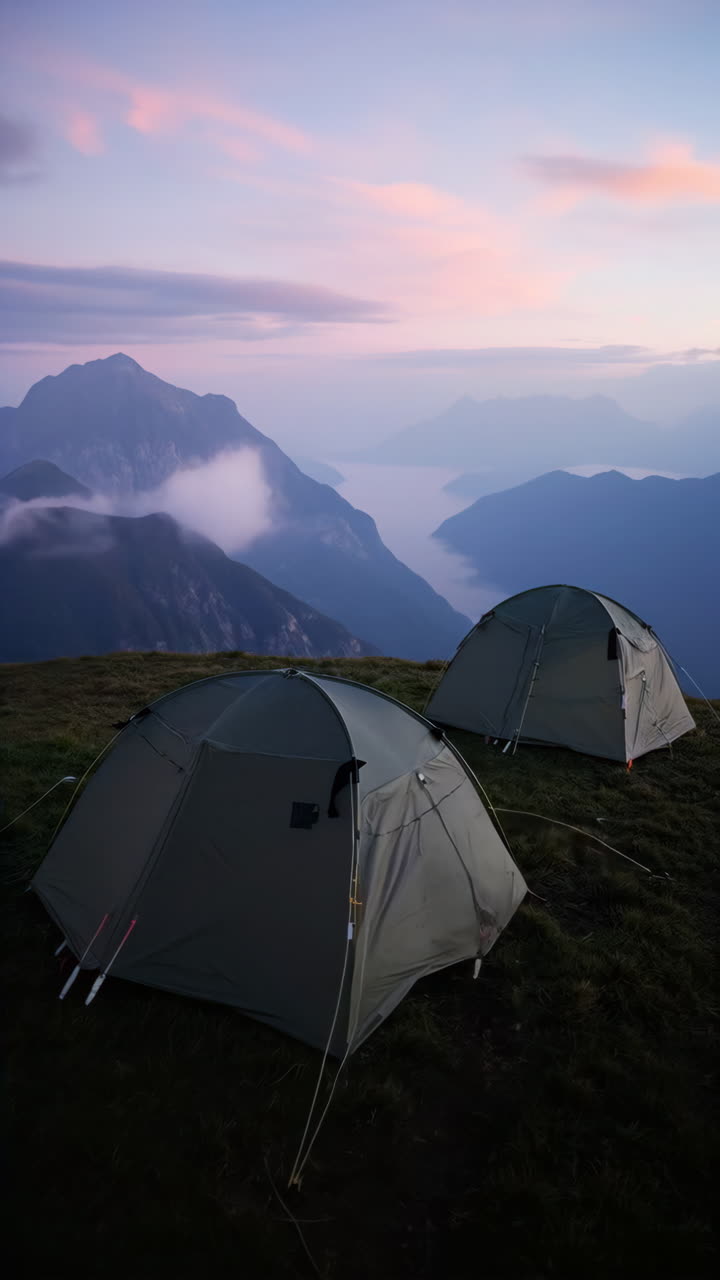 Tents on a Mountain Peak at Dawn