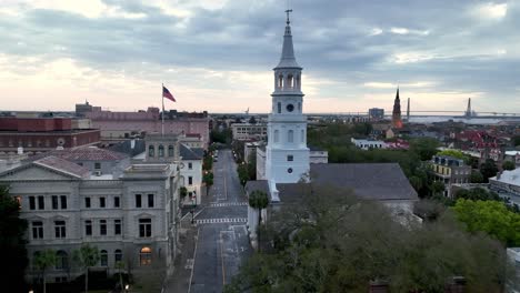 aerial push toward st michaels church at sunrise in charleston sc, south carolina