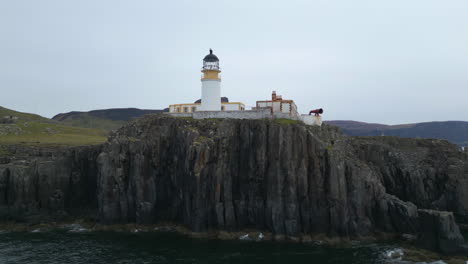 Neist-Point-Lighthouse-on-Steep-Cliff---Isle-of-Skye-Aerial-Orbit